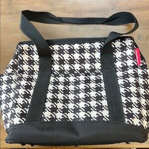 Houndstooth business bag with trolley sleeve.